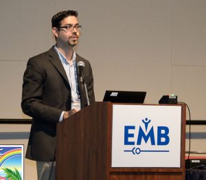 Manuel presenting at the podium at EMBC in 2018
