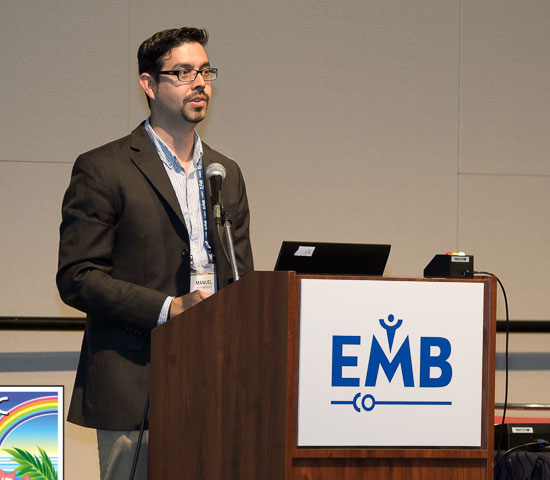 Dr. Hernandez presenting at the podium at EMBC in 2018